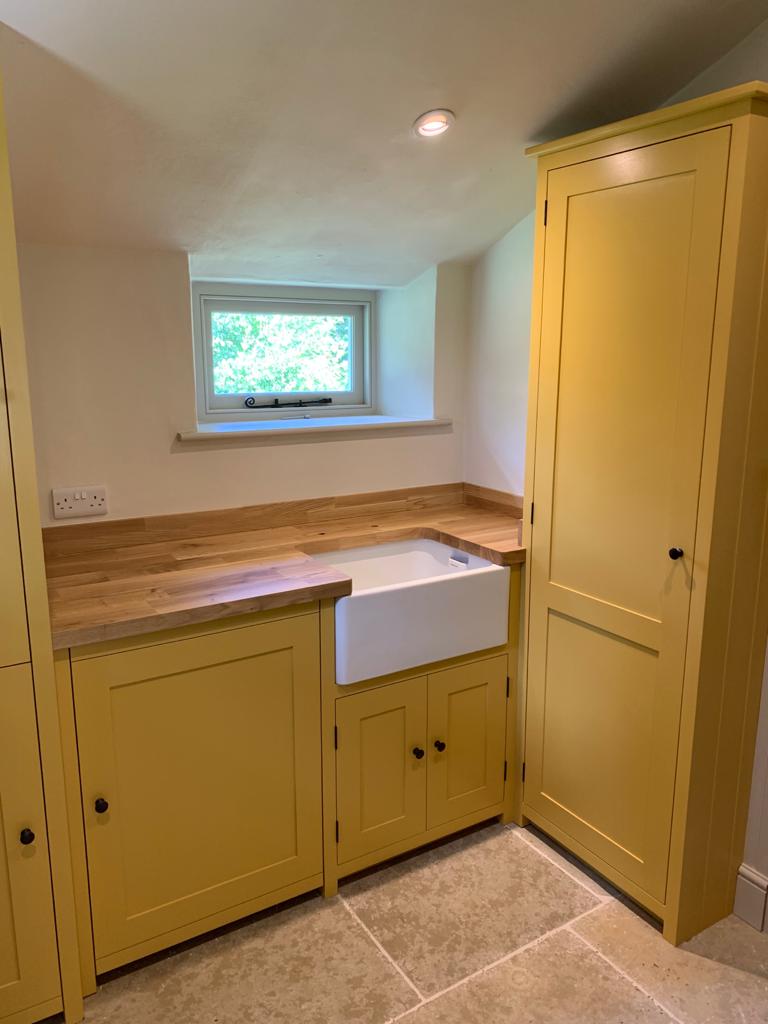 Bespoke hand painted shaker kitchen with solid oak worktop and Belfast sink fitted by Two Build in a period East Sussex cottage