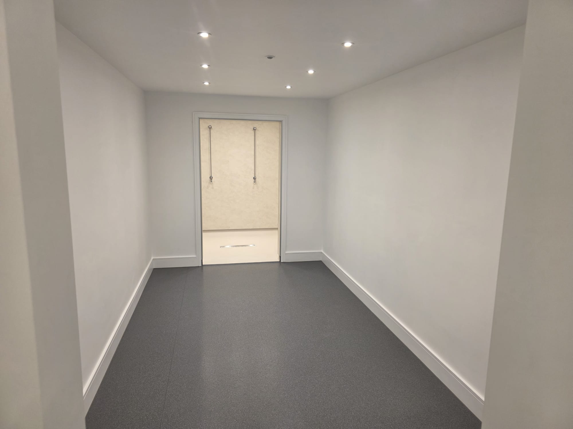 New clubhouse changing rooms with slip resistant flooring, floor drainage and communal showers